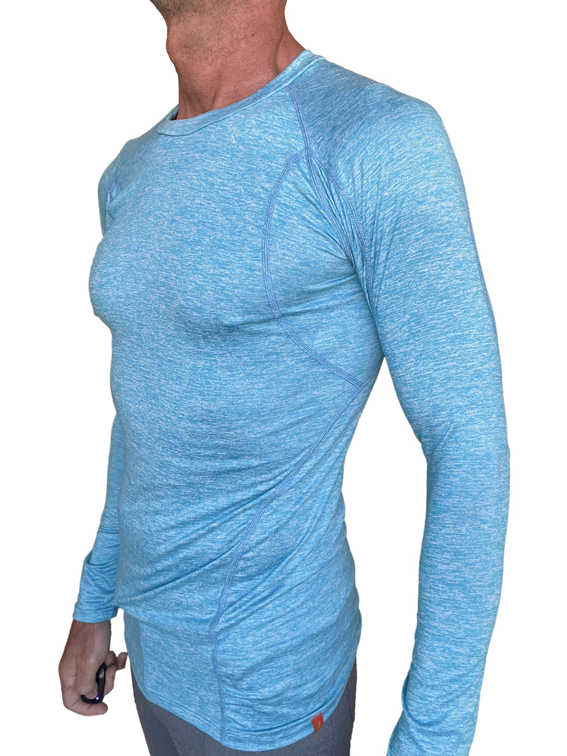 Light blue heathered long sleeve athletic shirt with subtle seam detailing in a designer raglan crew neck style