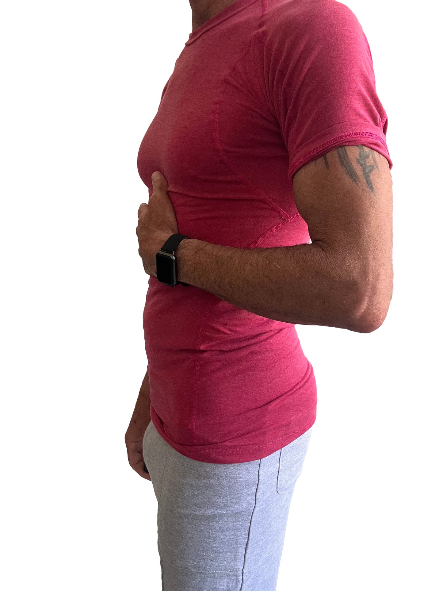 A person wearing a vibrant red designer raglan crew-neck tee with subtle ribbed texture and short sleeves