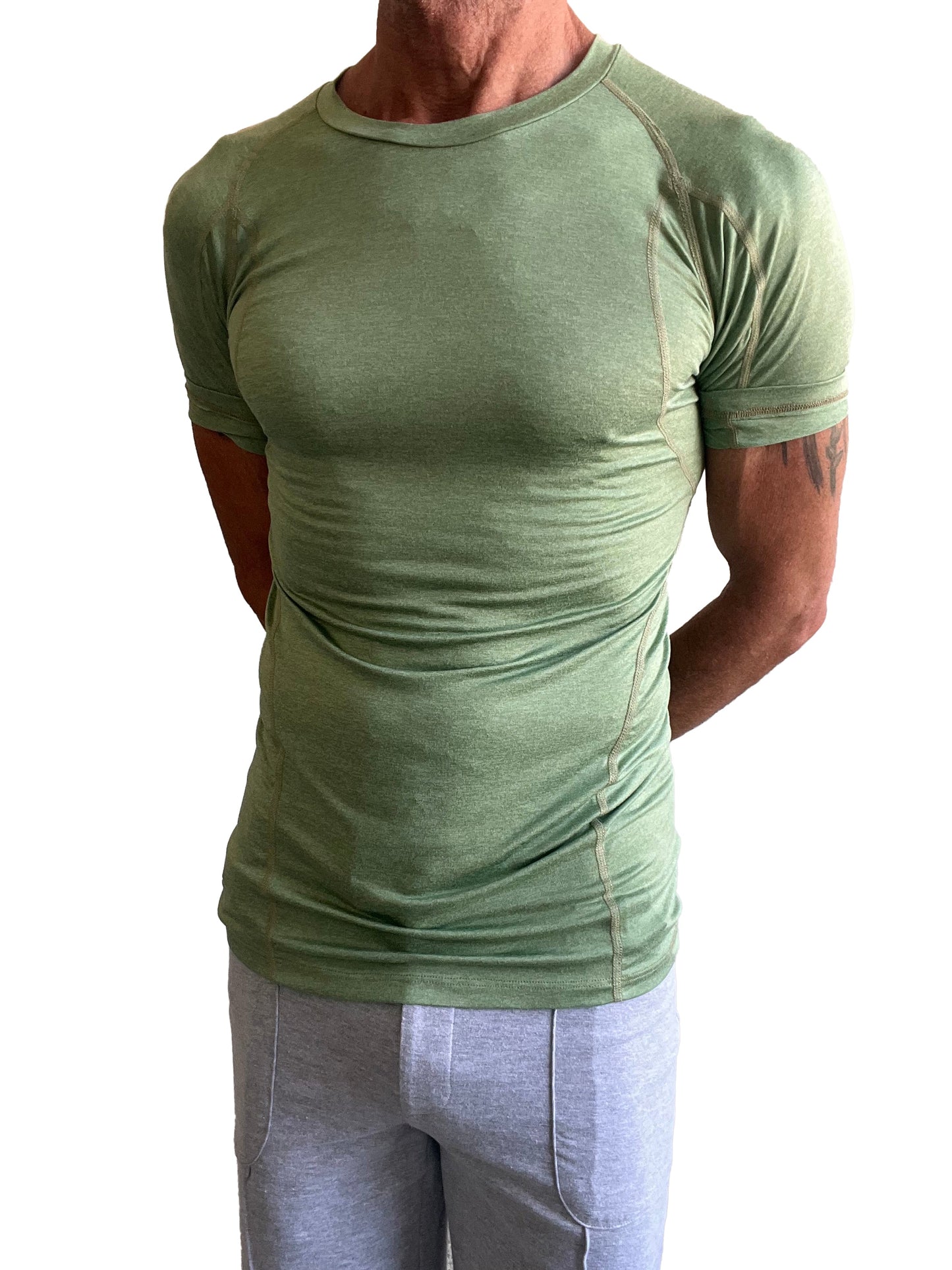 Olive green short-sleeved athletic shirt with crew neck and subtle seam detailing in designer raglan style