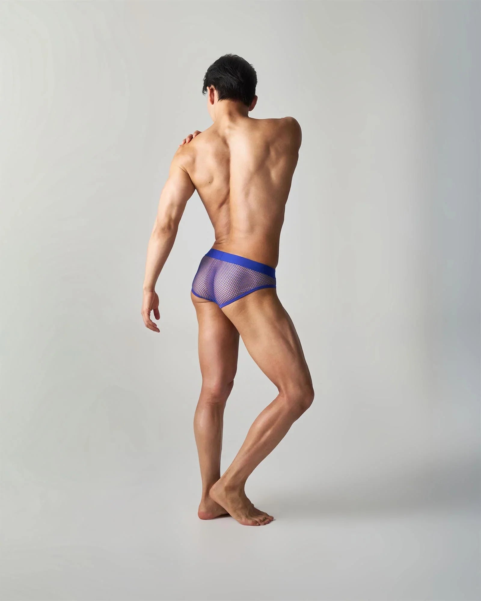 Blue mesh edge net brief with solid blue waistband designed for comfortable breathable support