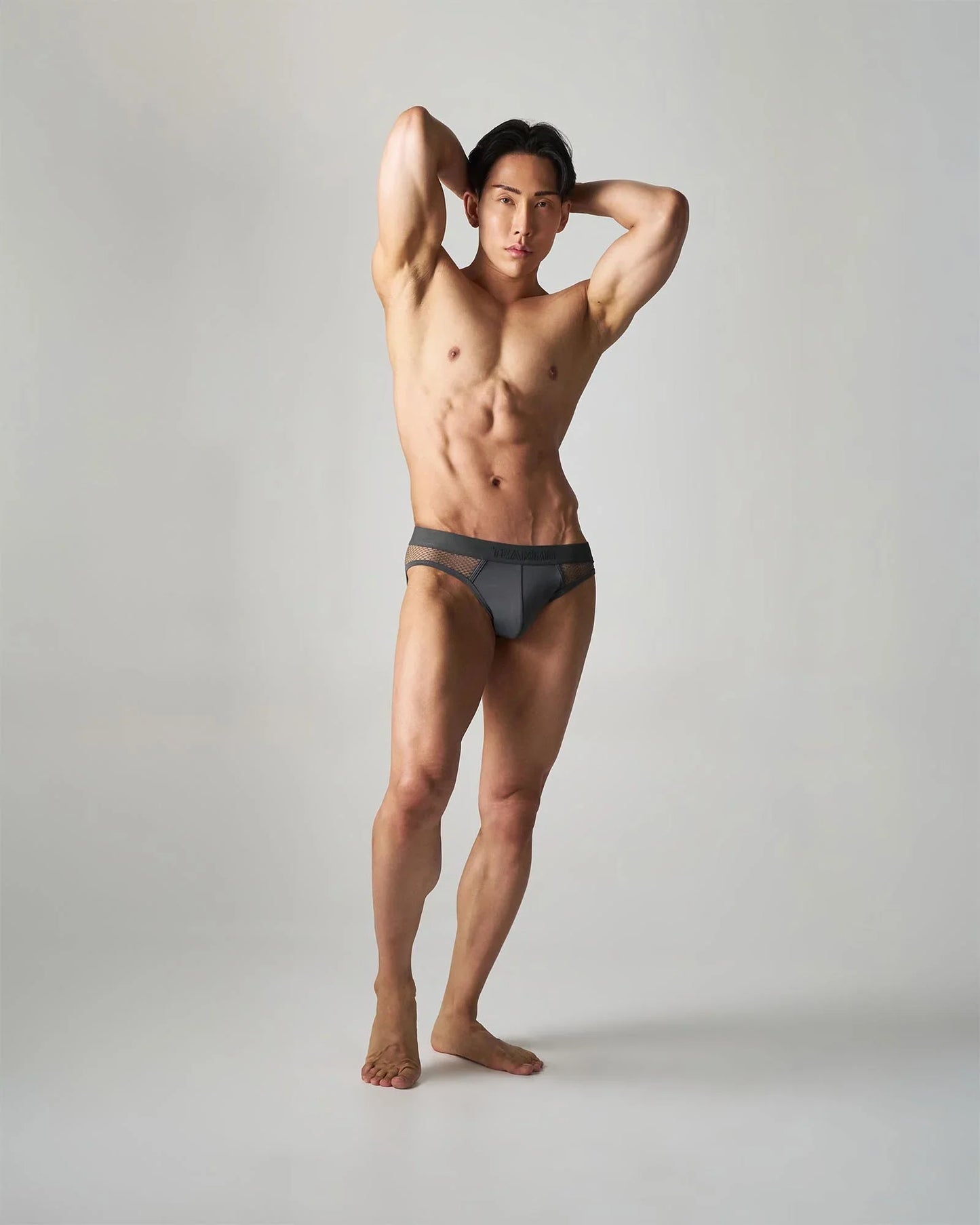 Dark gray edge net brief with breathable mesh trim featuring a comfortable low-rise design for everyday wear