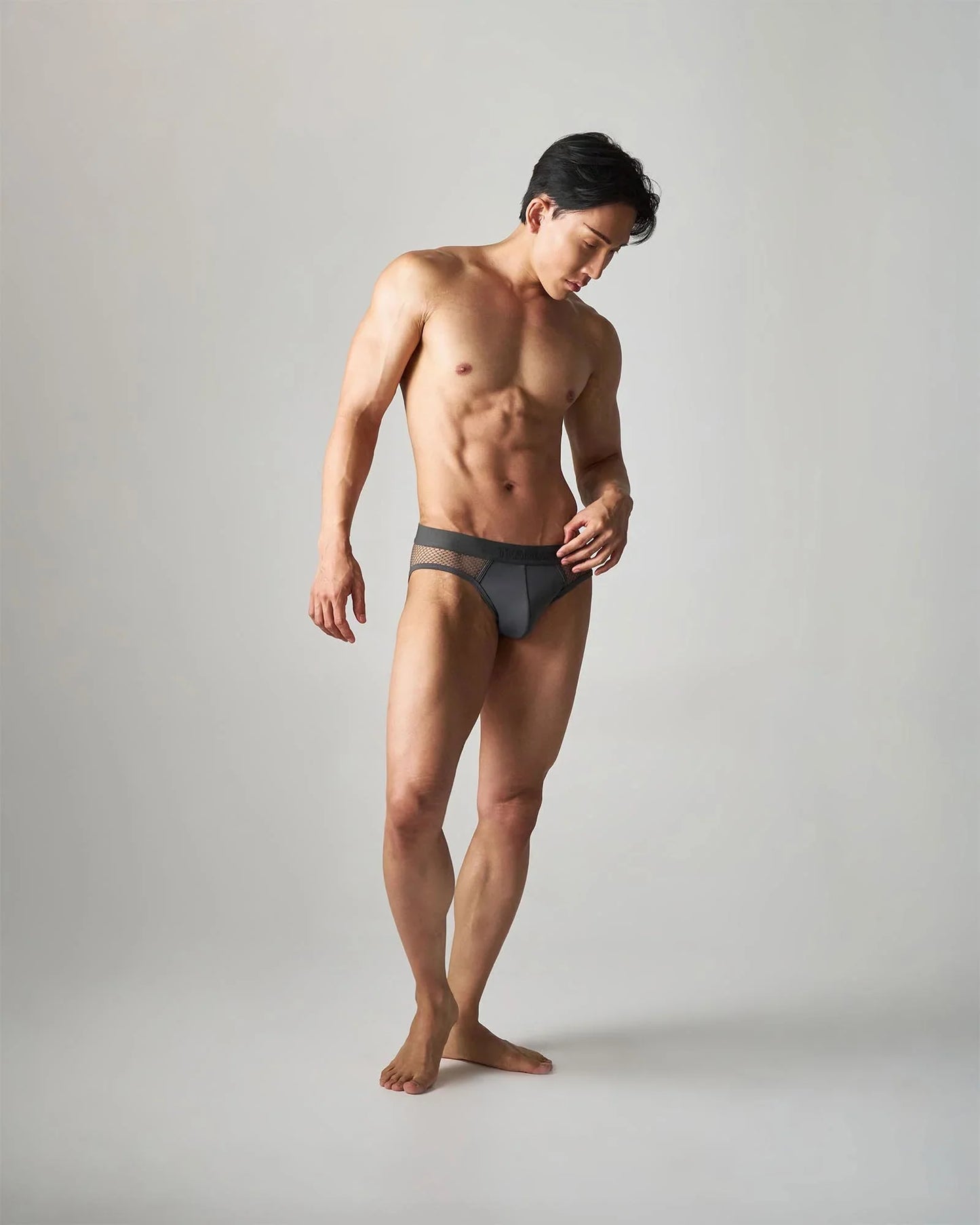 Dark gray edge net brief with breathable mesh trim offering comfort and style in a modern design
