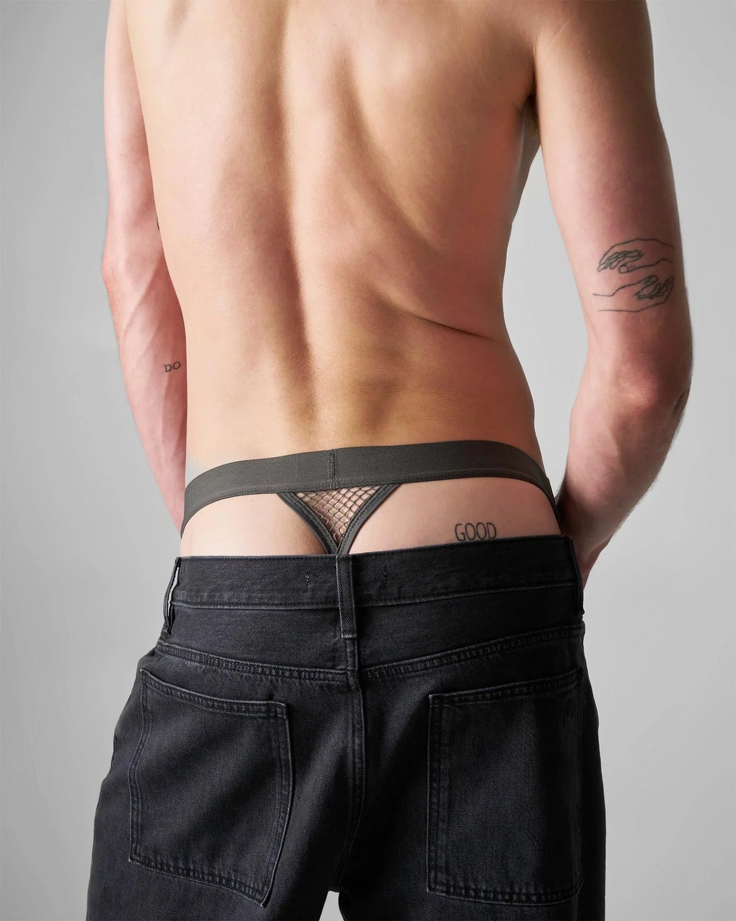 Black mesh thong with solid waistband and good embroidery on right side from edge net jock thong collection