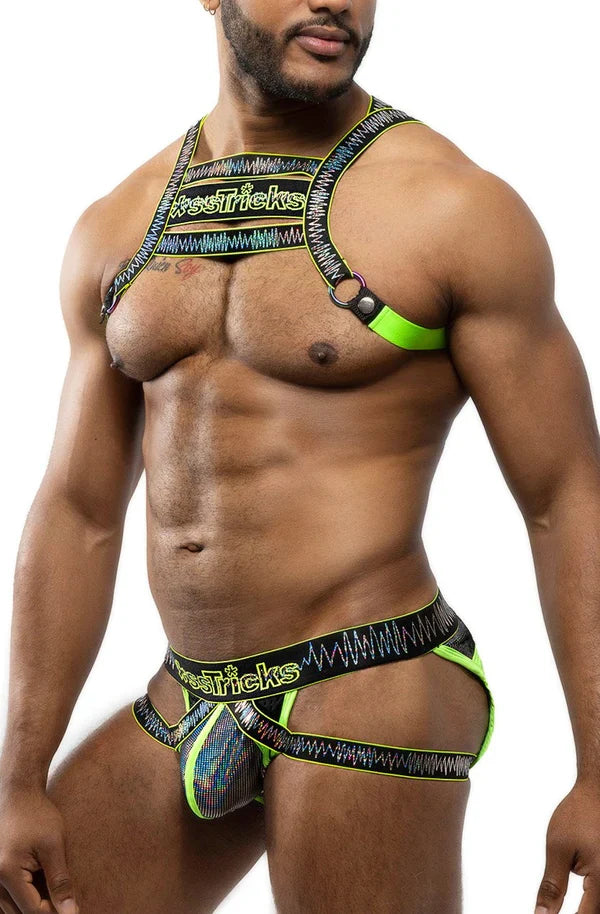 Vibrant neon green and black electro holographic harness lingerie set with bold patterned design visible from the back