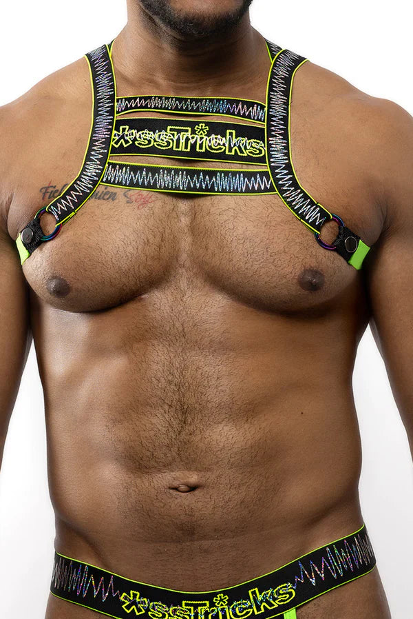 Neon green and black patterned electro holographic harness with xse*ricks branding and adjustable straps