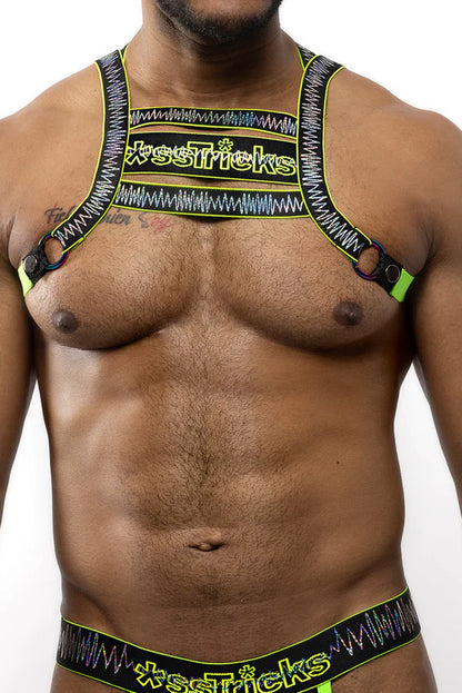Neon green and black patterned electro holographic harness with xse*ricks branding and adjustable straps