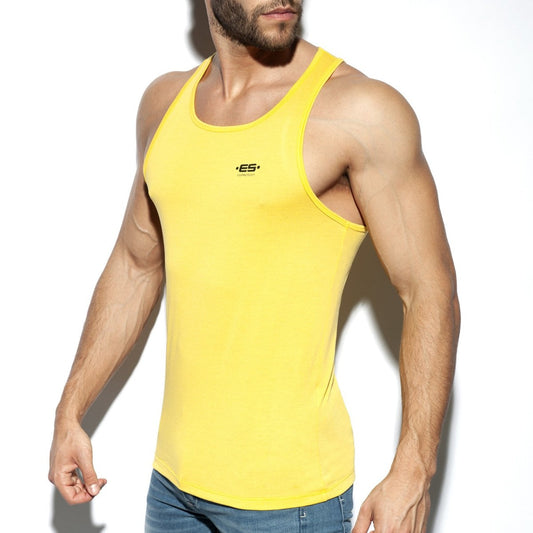 Bright yellow form-fitting ES Basic Tank with a small black logo on the chest made from soft breathable fabric