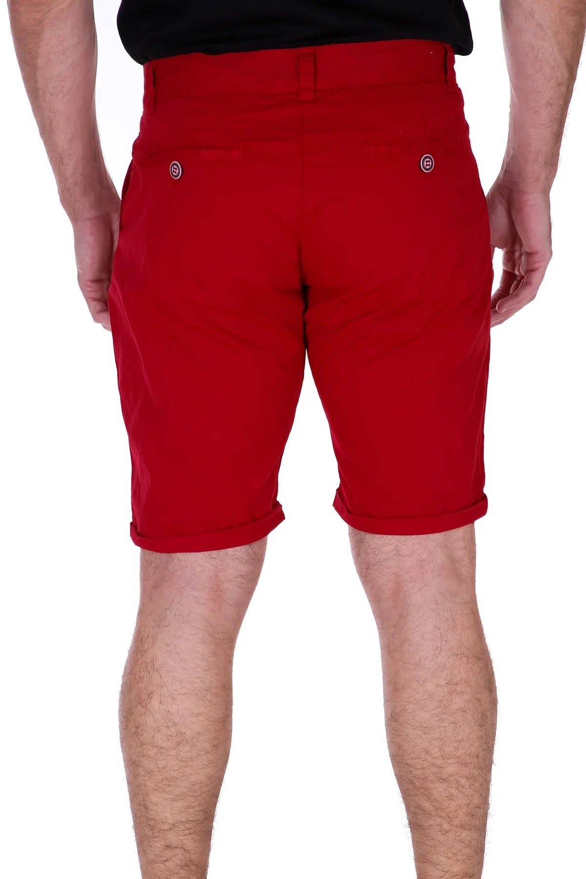Back view of red essential cotton chino shorts with rolled cuffs and small circular brand logos on pockets