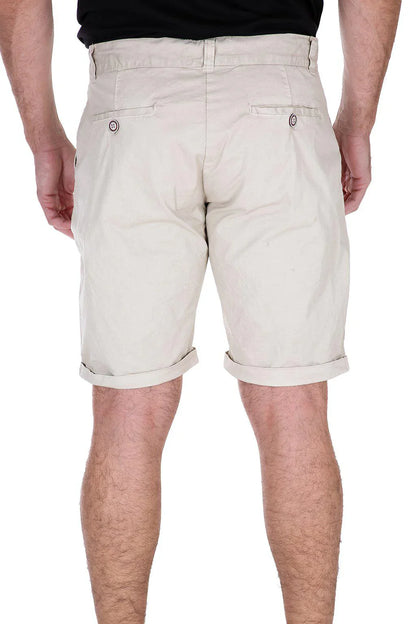 Beige essential cotton chino shorts with rolled cuffs and buttoned back pockets shown from the back side