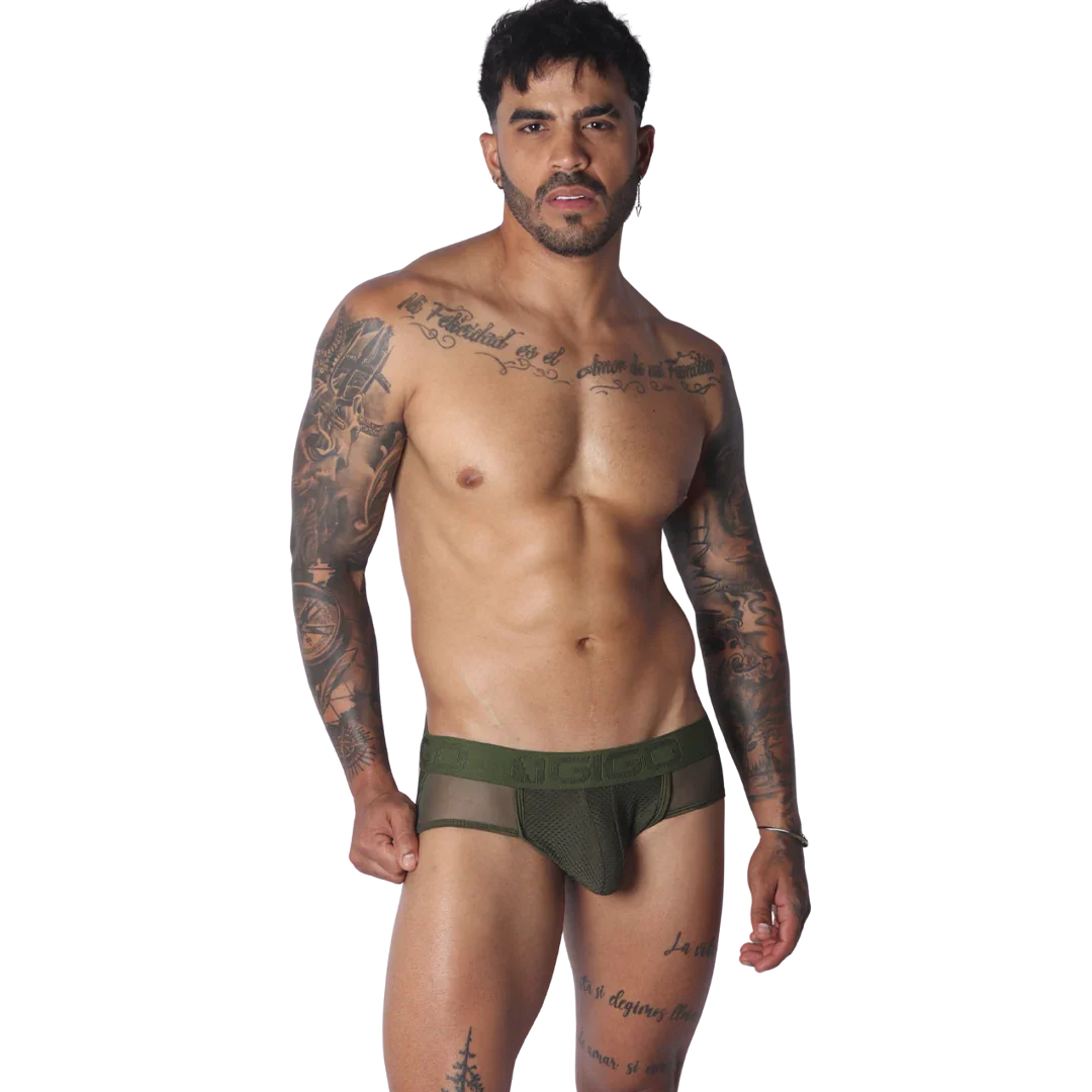 Olive green jockstrap featuring a mesh pouch and branded elastic waistband on a tattooed model.