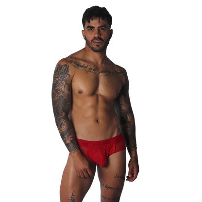 Bright red athletic jock-thong with a mesh pouch and a wide, logo-branded elastic waistband.