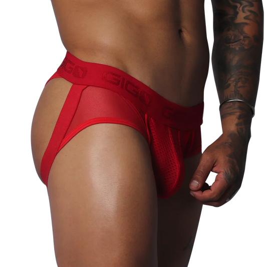 Red jockstrap thong featuring sheer mesh fabric, a pouch, and a branded elastic waistband on a muscular torso.