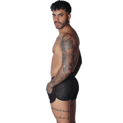 Black athletic mesh short with a curved hemline and pocket detail, worn by a shirtless man.