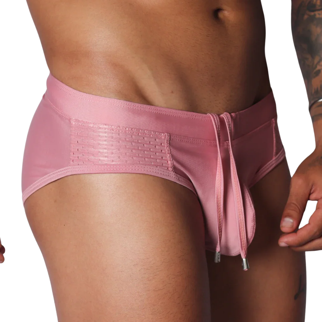 Gigo pink swim brief with mesh side panels and a drawstring waist featuring metal-tipped ties.
