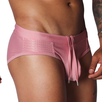 Gigo pink swim brief with mesh side panels and a drawstring waist featuring metal-tipped ties.