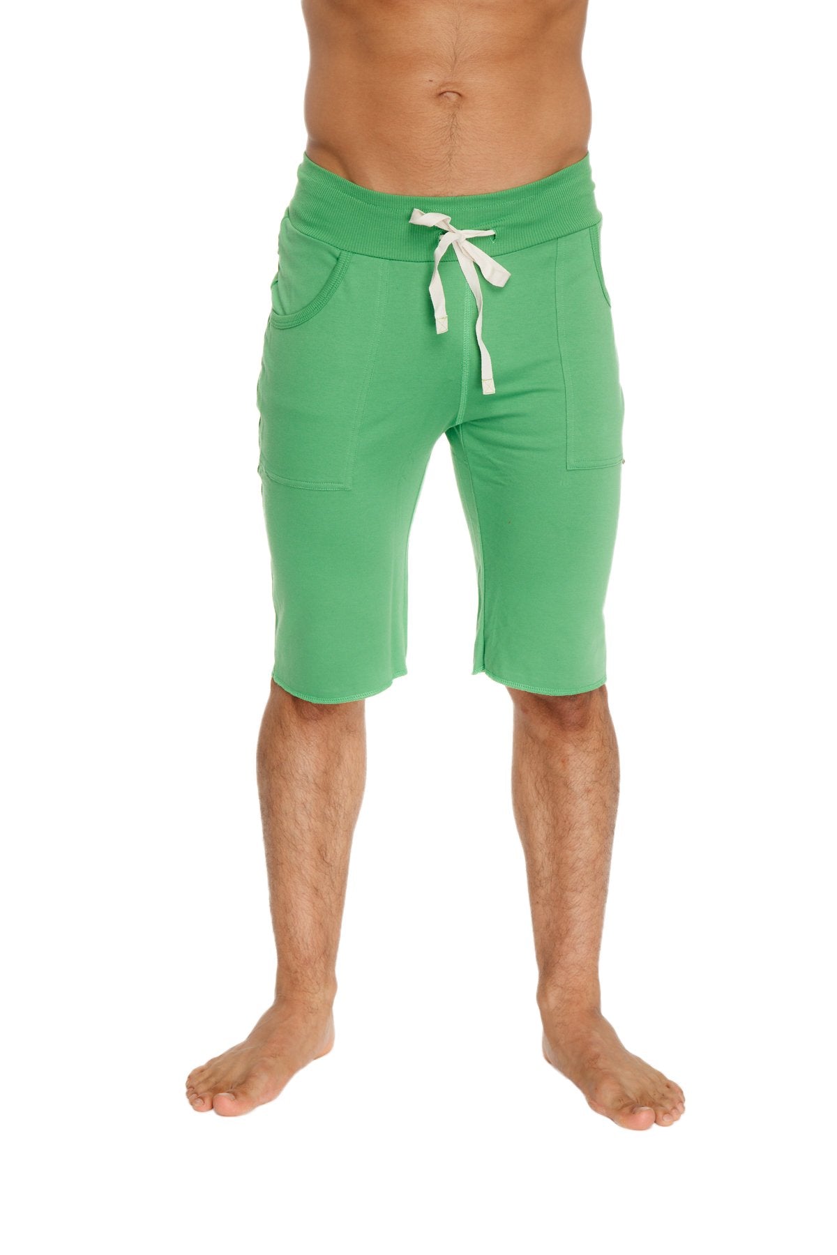 Green eco-track short made from bamboo fabric with white drawstring and side pockets for athletic use