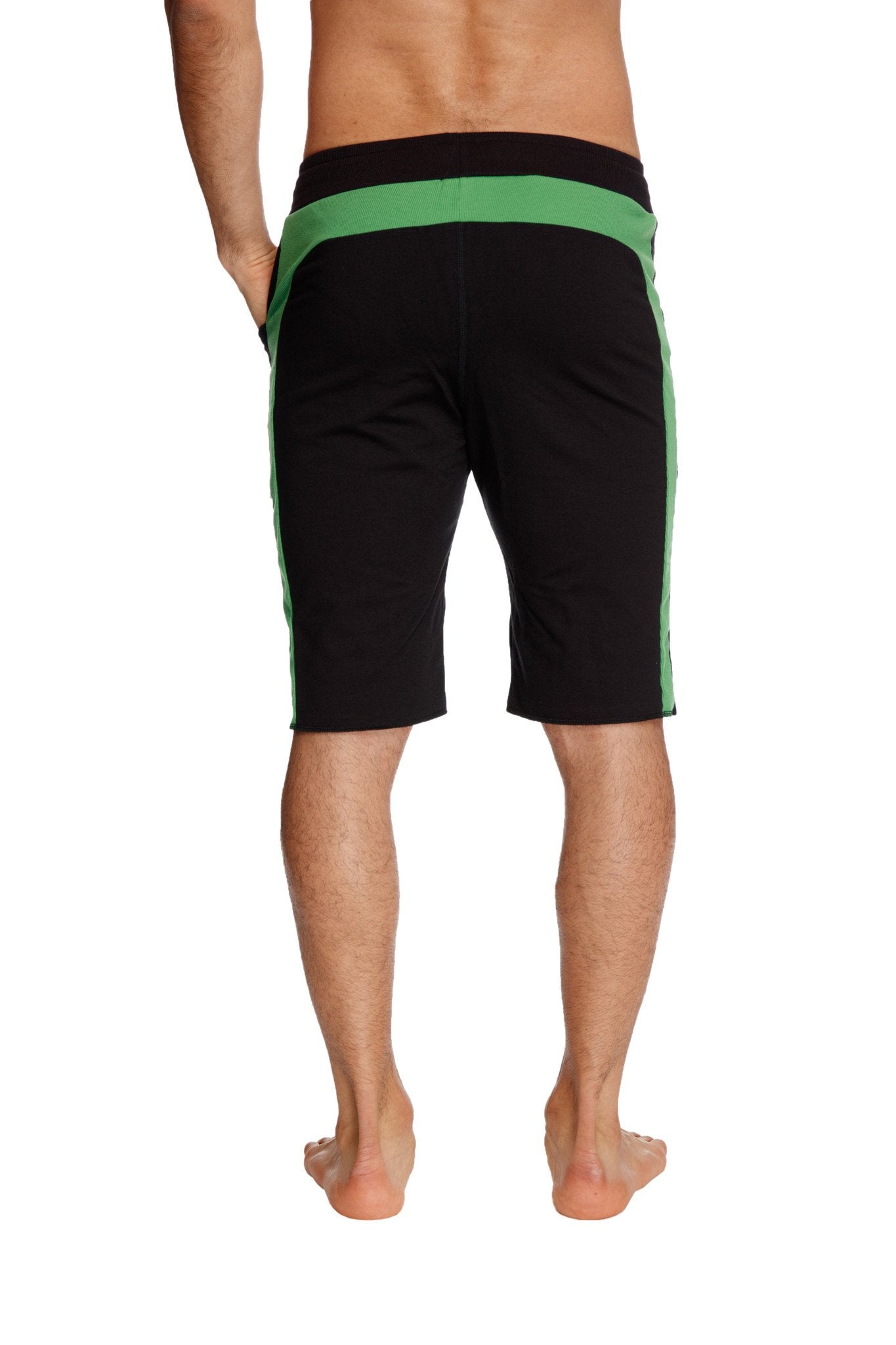 Eco-track short in black with vibrant bamboo green side stripes and waistband made from eco-friendly materials