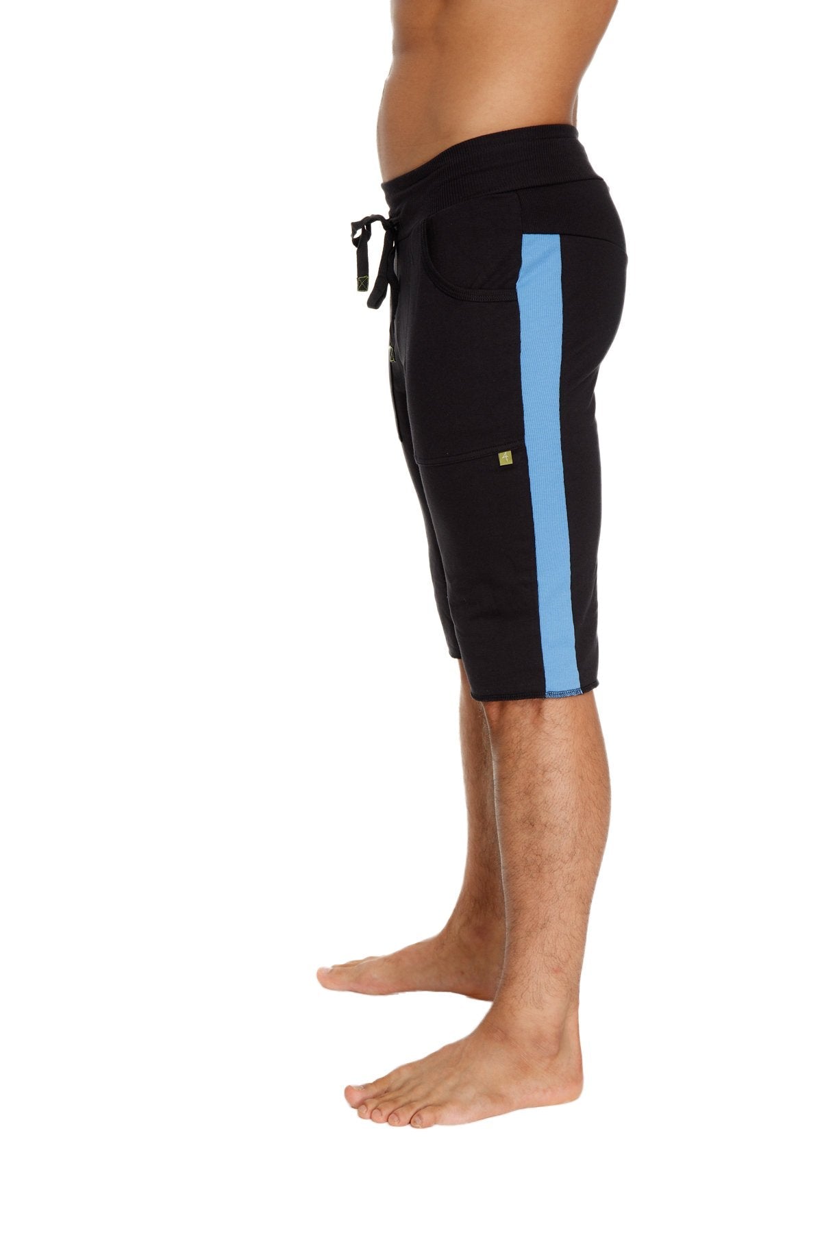 Black eco-track athletic shorts with vertical light blue stripe and yellow logo on the thigh