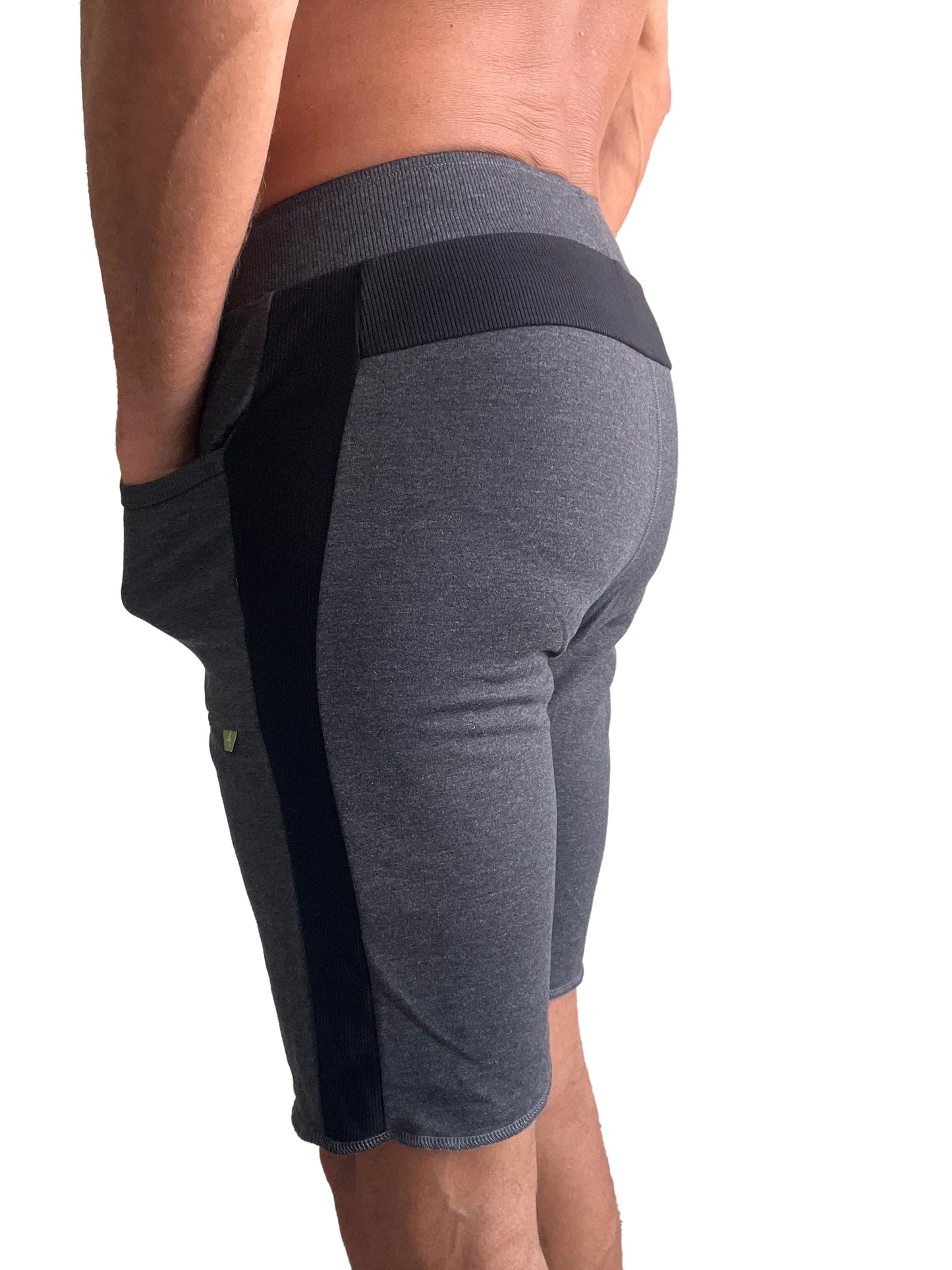 Eco-track short charcoal with black athletic shorts featuring ribbed waistband side panels and green logo on thigh