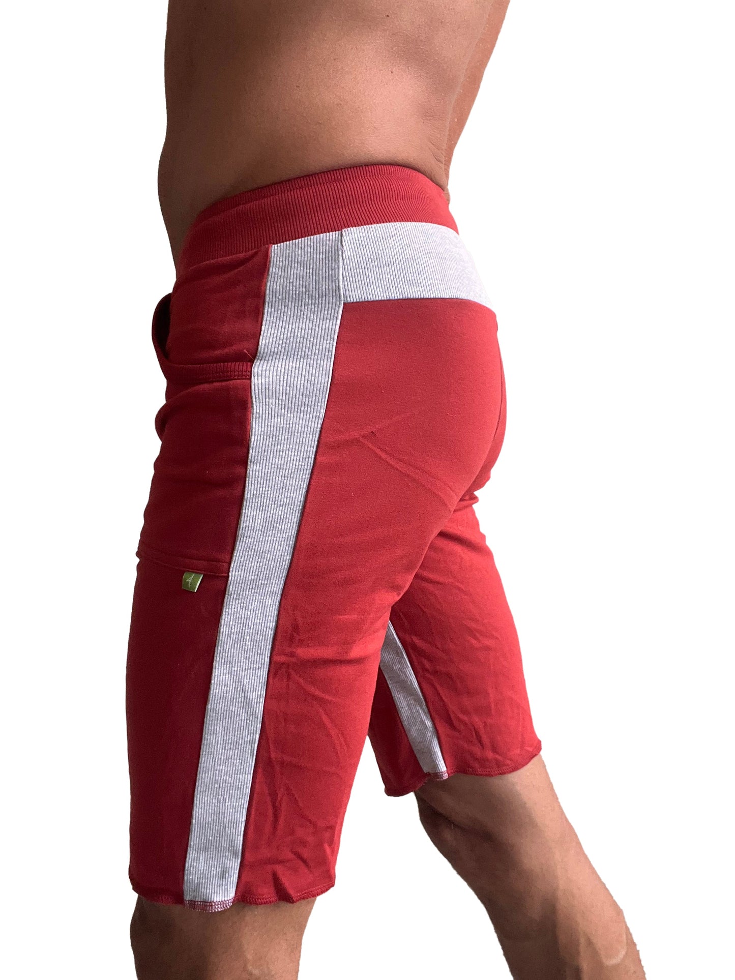 Eco-Track short in cinnabar red with white and gray striped side panel designed for athletic performance