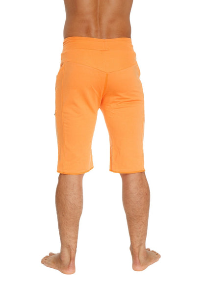 Eco-track short in sun orange with relaxed fit and side pockets made from eco-friendly material for athletic use