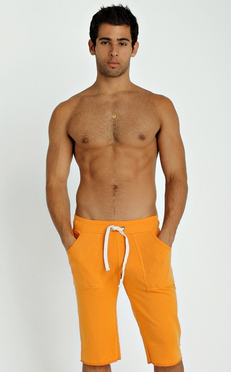 Eco-track short sun orange athletic shorts with white drawstring and side pockets for comfortable activewear