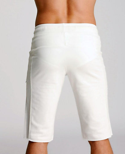 White eco-track shorts with a clean tailored fit and subtle side pockets made from sustainable fabric