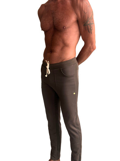 Eco-track and yoga sweat pant in dark gray with white drawstring and subtle side pockets for athletic use