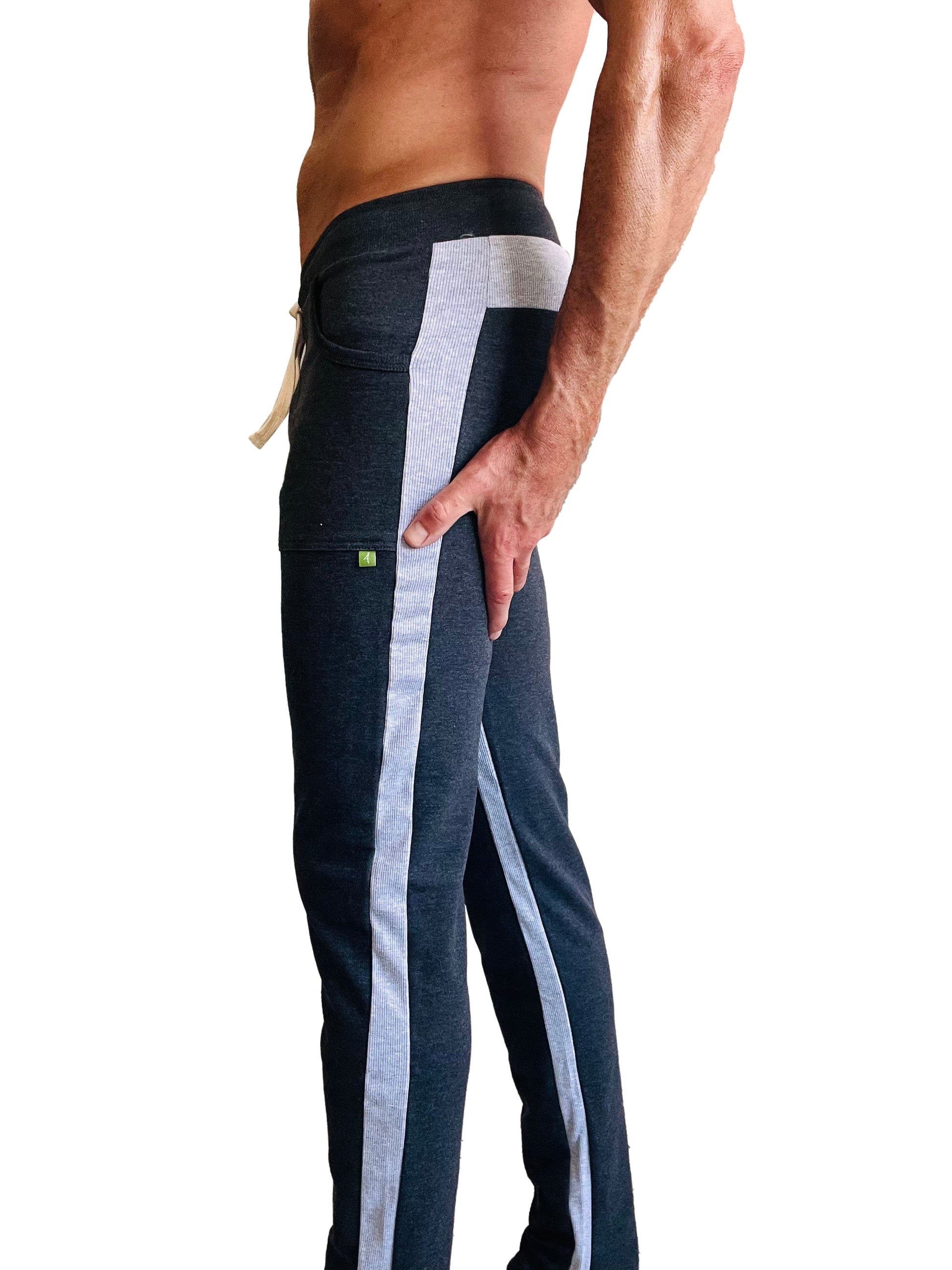 Eco-Track & yoga sweat pant in charcoal with grey stripes featuring a side pocket and green logo on the thigh