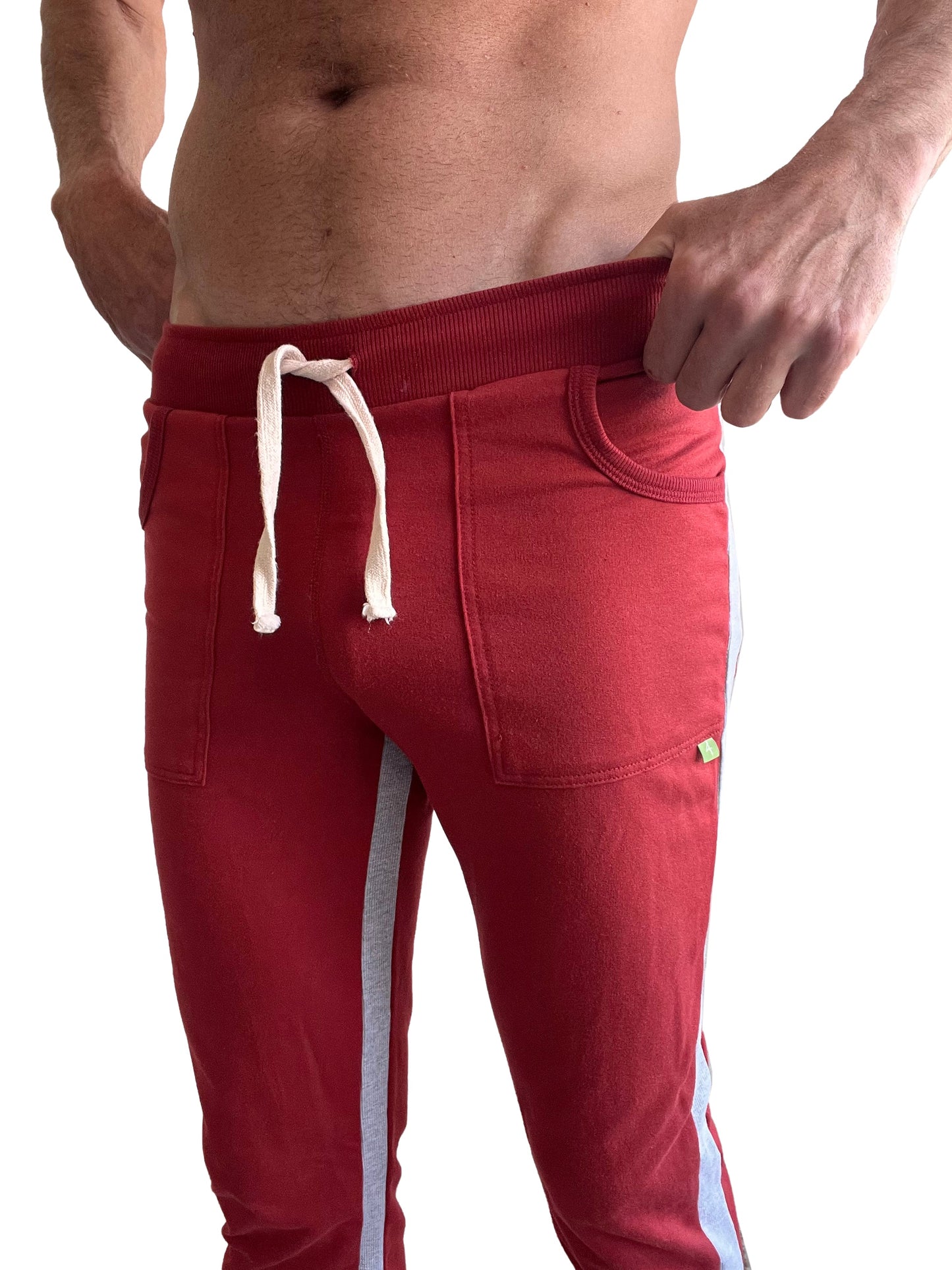 Eco-track and yoga sweat pant in cinnabar red with gray side stripes and white drawstrings for athletic use