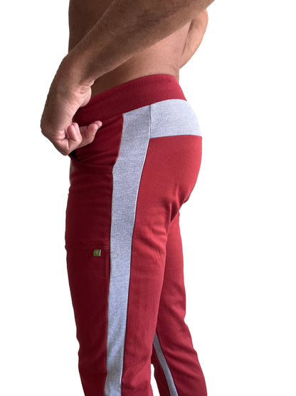 Eco-track and yoga sweat pant in cinnabar red with gray vertical ribbed stripe and matching gray waistband trim