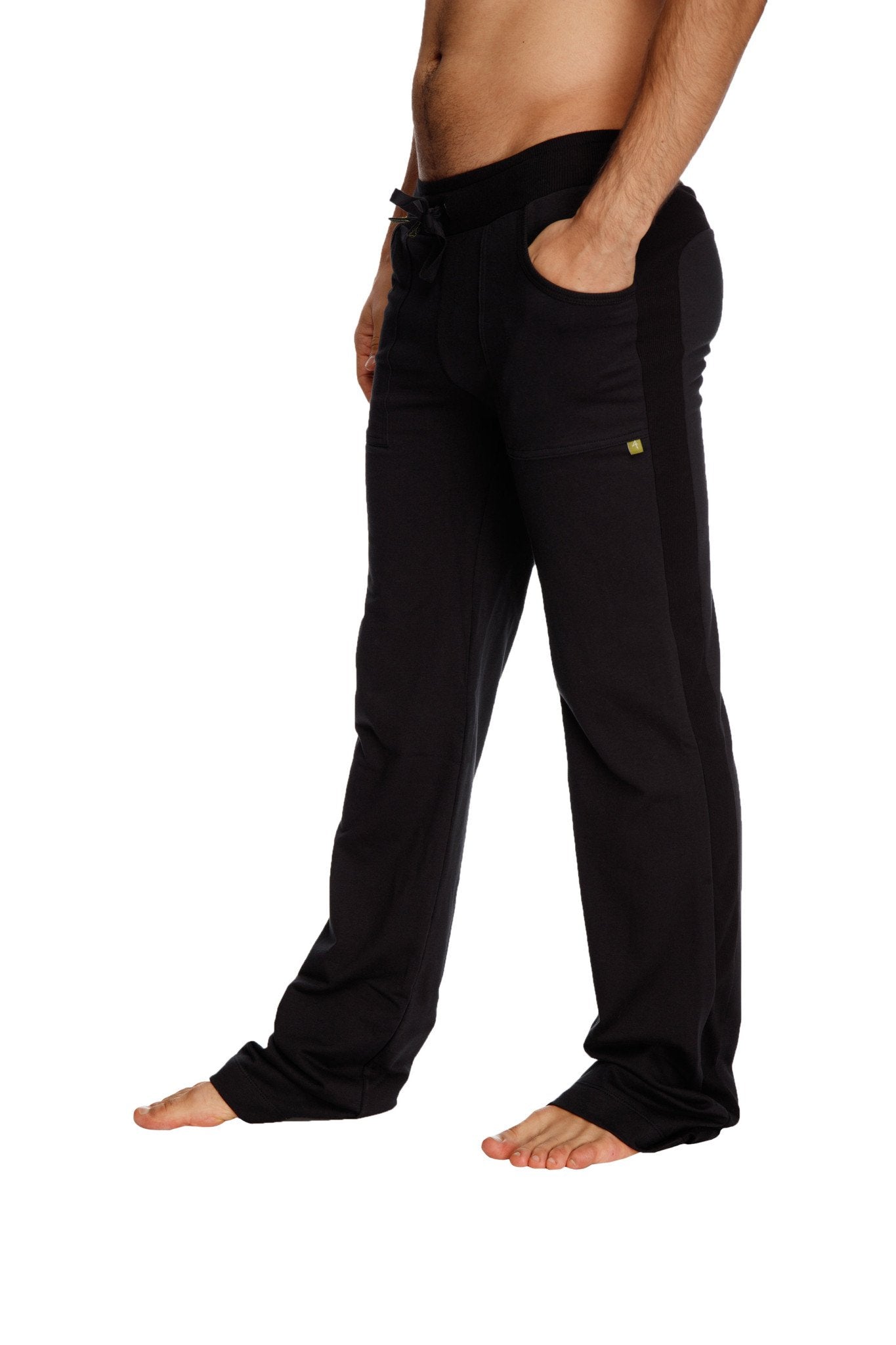 Black eco-track & yoga sweat pants with drawstring waistband and subtle yellow logo on the thigh