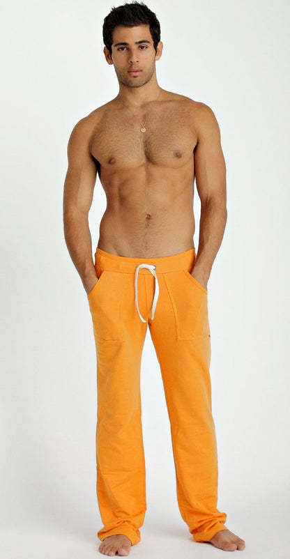 Orange eco-track and yoga sweatpant in sun orange with white drawstring waistband made from sustainable fabric