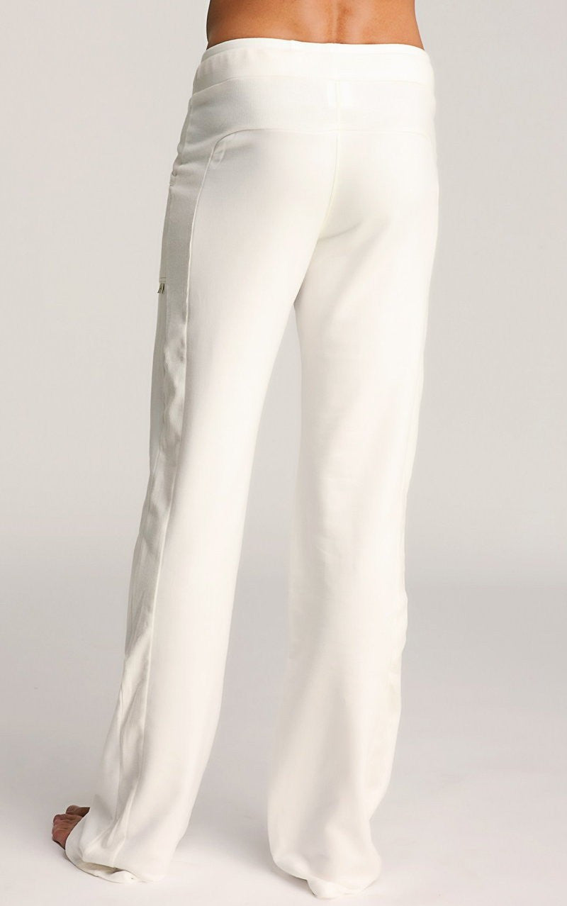 White eco-track and yoga sweat pant with flowing wide-leg smooth fabric and subtle side seam detailing