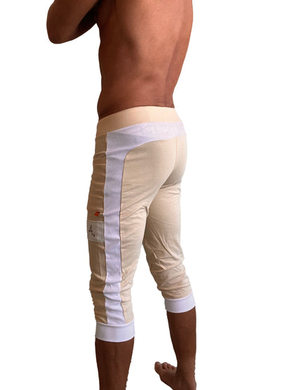 Beige edge cuffed yoga pants with white mesh side panels and elastic cuffs perfect for athletic wear
