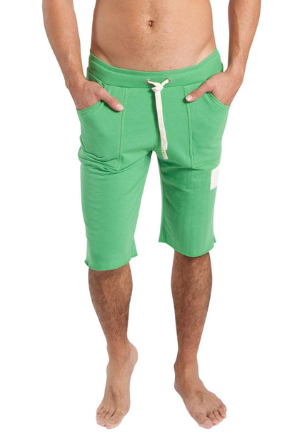 Green athletic edge eco-track shorts with white drawstring and side pockets made from bamboo material