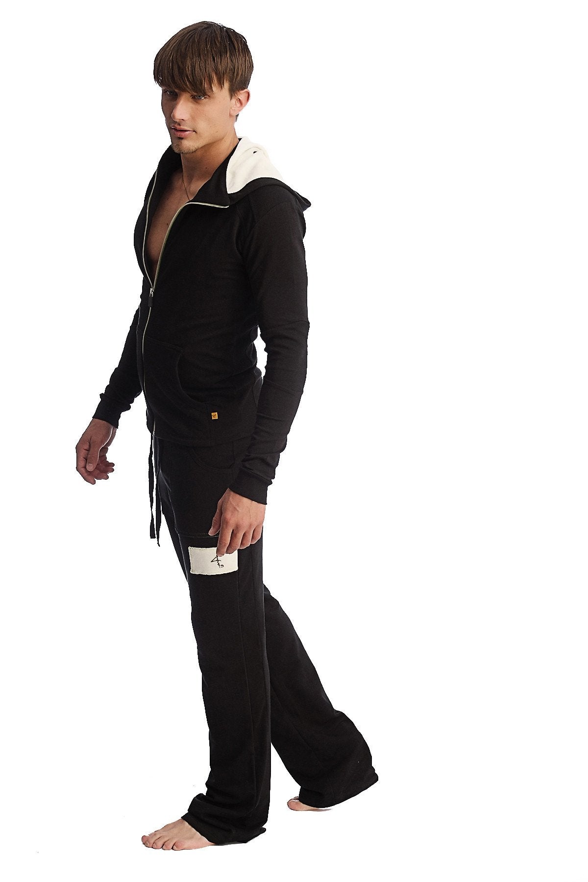 Black zip-up hoodie and matching edge eco-track and yoga sweat pant set with white-lined hood and gold zipper pull
