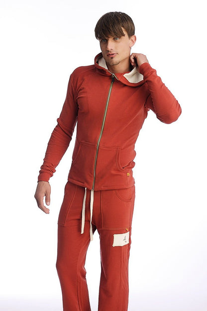 Edge form-fit crossover yoga track performance hoodie in cinnabar red with cream lining and matching drawstring pants