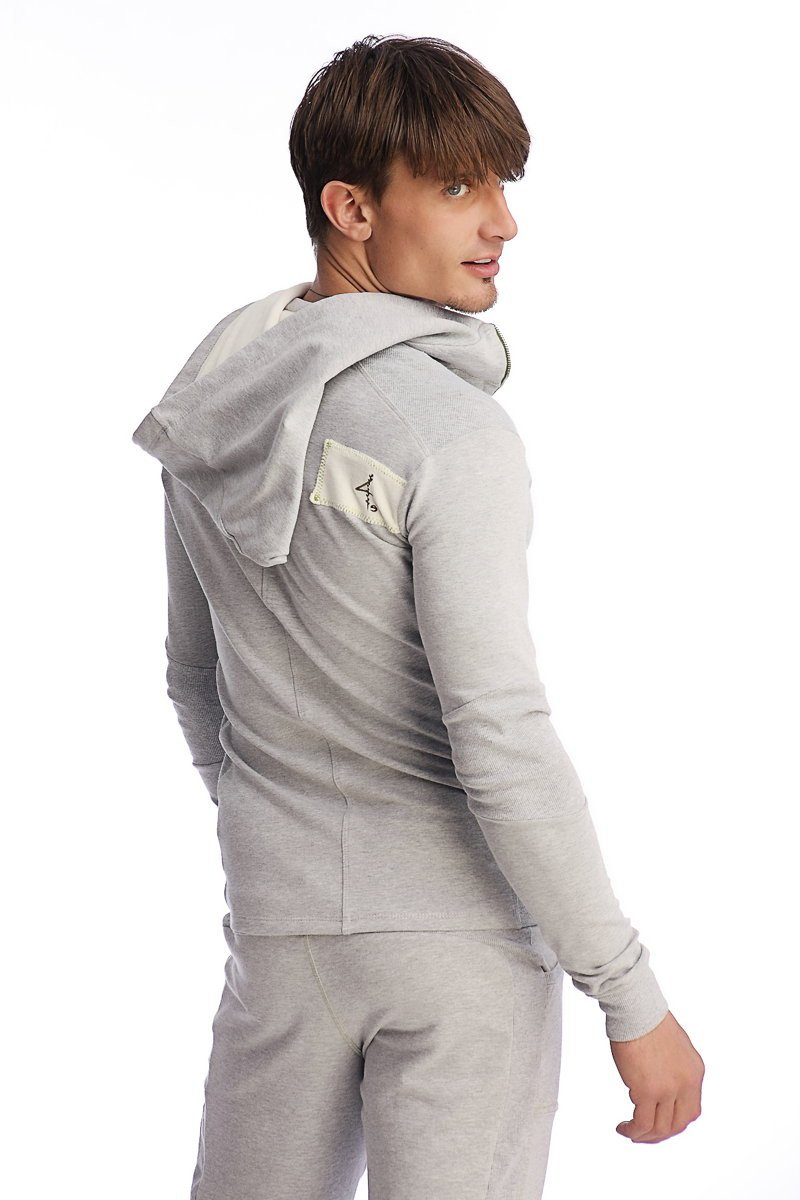 Gray heather edge form-fit crossover yoga track performance hoodie with small beige patch on left shoulder