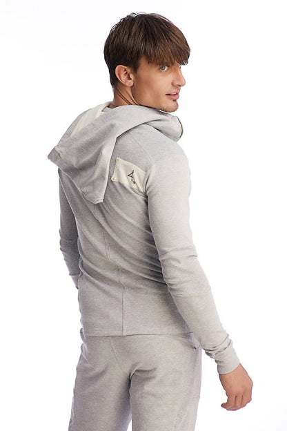 Gray heather edge form-fit crossover yoga track performance hoodie with small beige patch on left shoulder