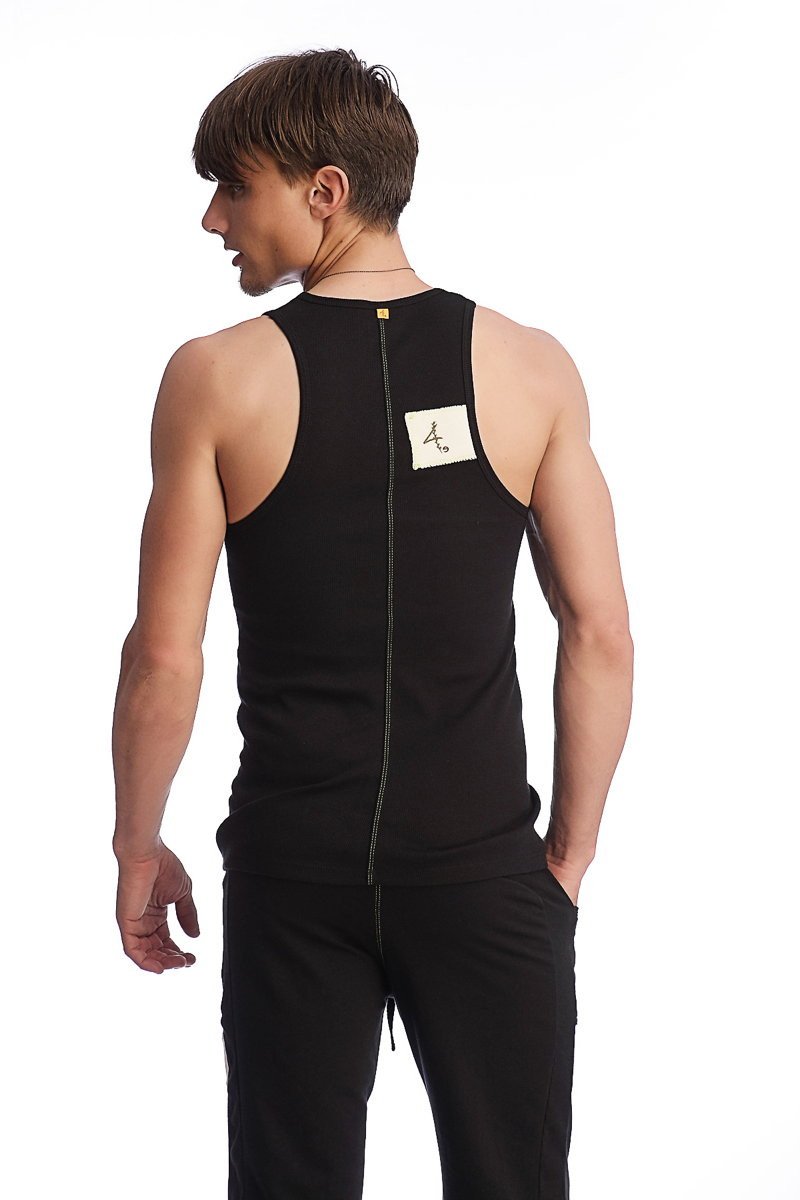 Back view of black edge sustain tank top with sleeveless design, central zipper, and white logo label