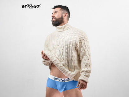 Cream-colored cable knit turtleneck sweater from ergowear paired with light blue max cotton trunks ew1713