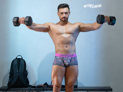 Black hexagonal dumbbells paired with ergowear ew1716 max se camo trunks in pink color for fitness use