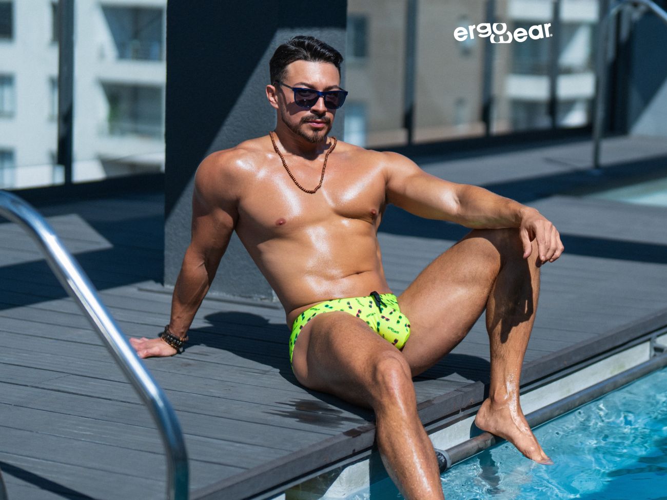 Vibrant neon green ergoWear ew1765 x4d swim briefs with black splatter patterns in bright yellow color