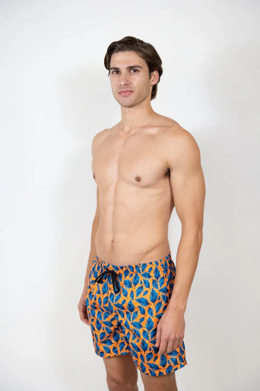 Men’s feather print swim shorts with vibrant blue and orange leaf pattern on stretch fabric and black drawstring waistband