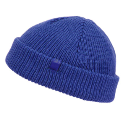 A vibrant royal blue ribbed knit fisherman dock knit cuff beanie with a folded cuff and matching square tag