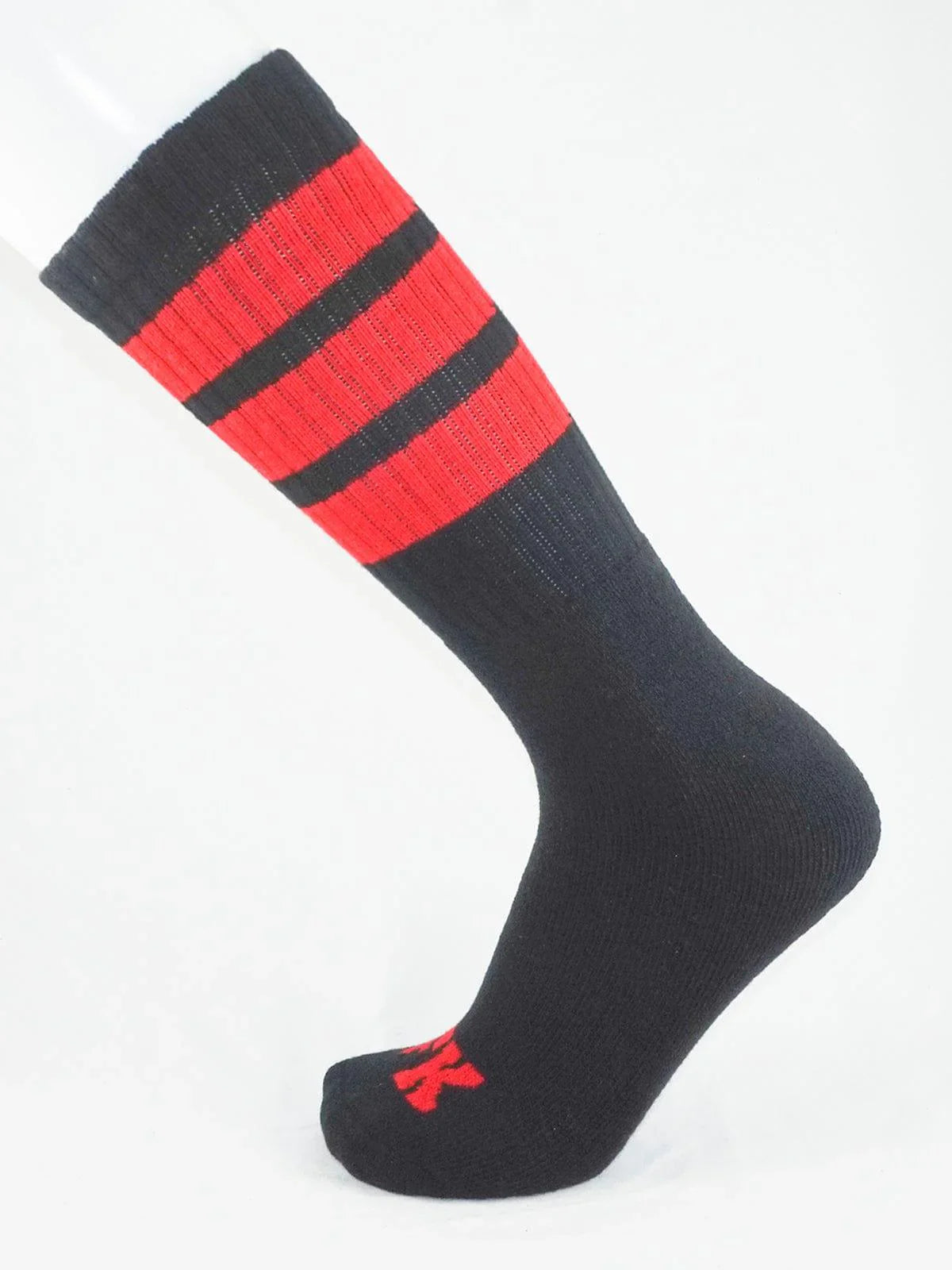 Fk sport black tube sock featuring bold red stripes and a small red logo on the toe for athletic use