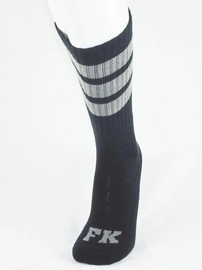 Fk sport black tube sock with three gray stripes and silver fk logo embroidered on the toe for athletic use