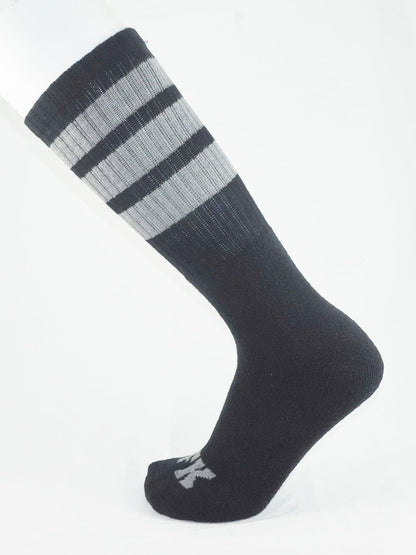 Fk sport black tube sock with ribbed texture and three horizontal stripes on top cuff for athletic use
