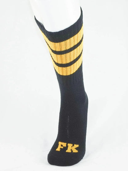 Fk sport black tube sock with three gold stripes and fk logo embroidered on the toe in gold thread